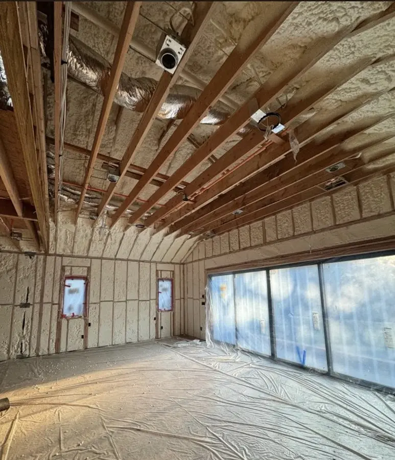 Interior walls and ceiling insulated with spray foam during new construction in Greece